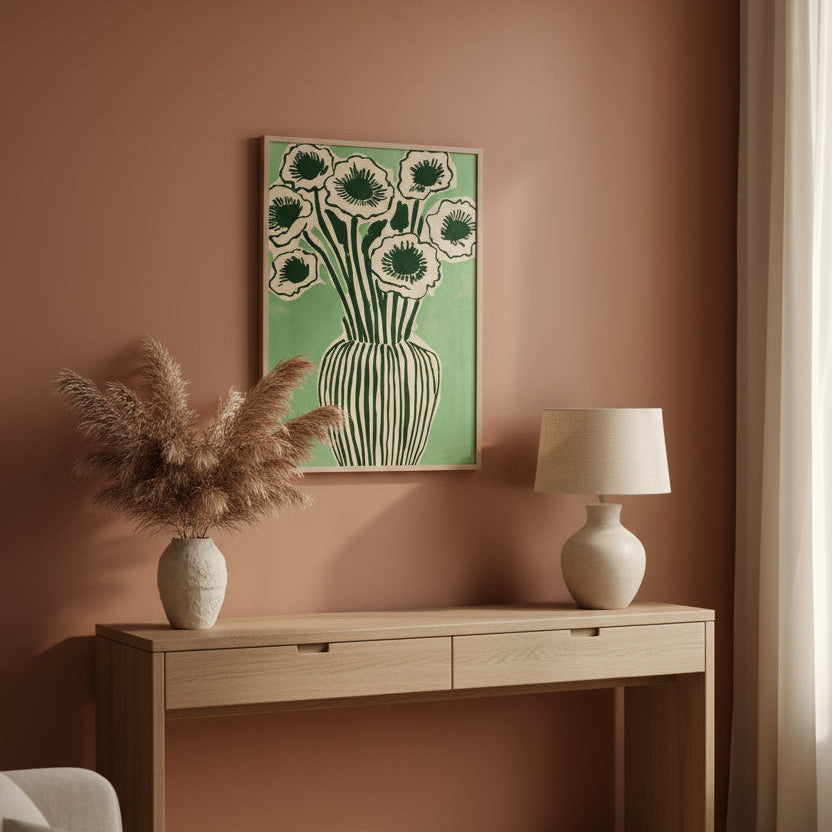 Living room with a wooden console table, lamp, and decorative vase against a pink wall with a floral painting.